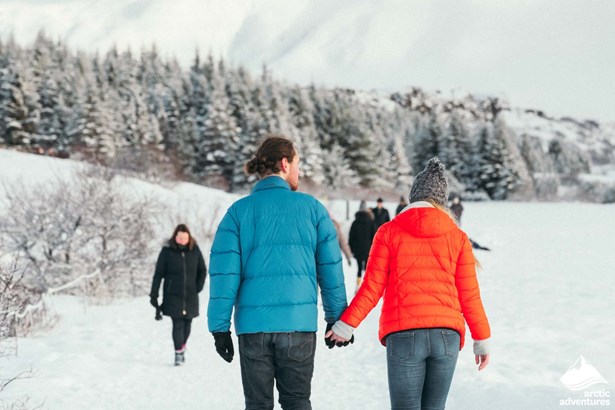 Couple Walking in Thingvellir National Park during Winter