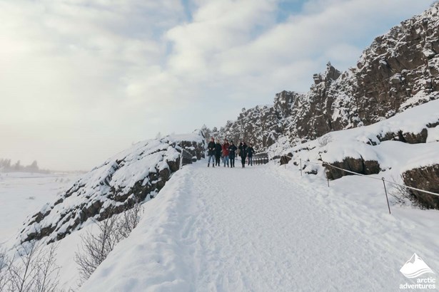 People Walking Between Tectonic Plates in Iceland