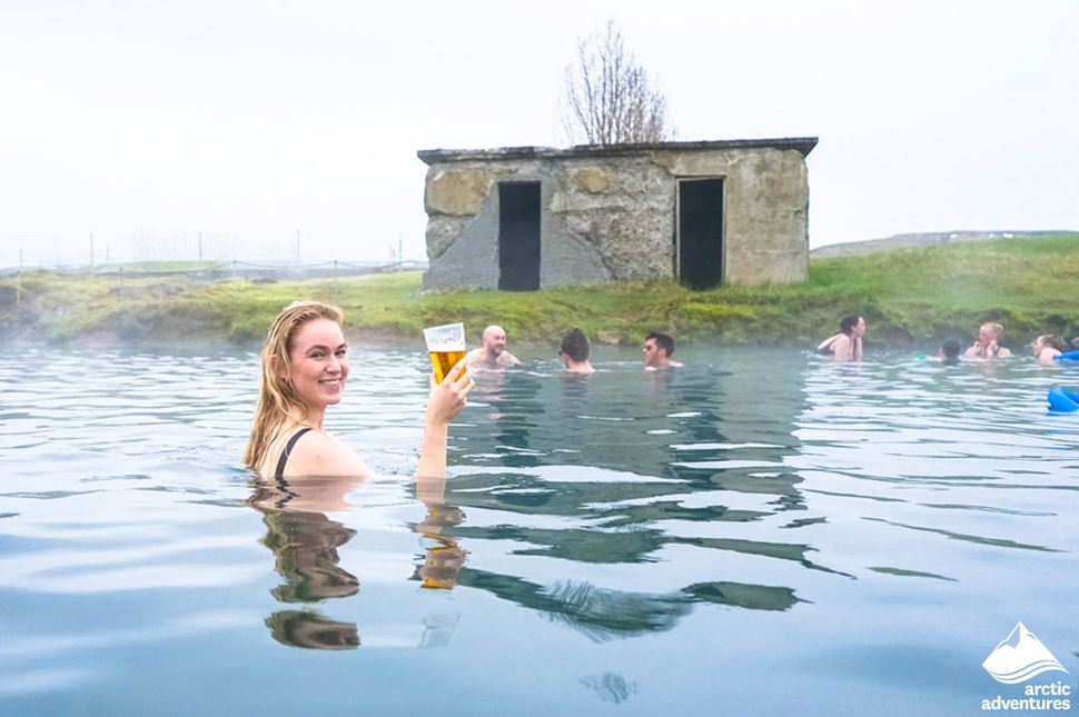 Woman Having Beer in Secret Lagoon