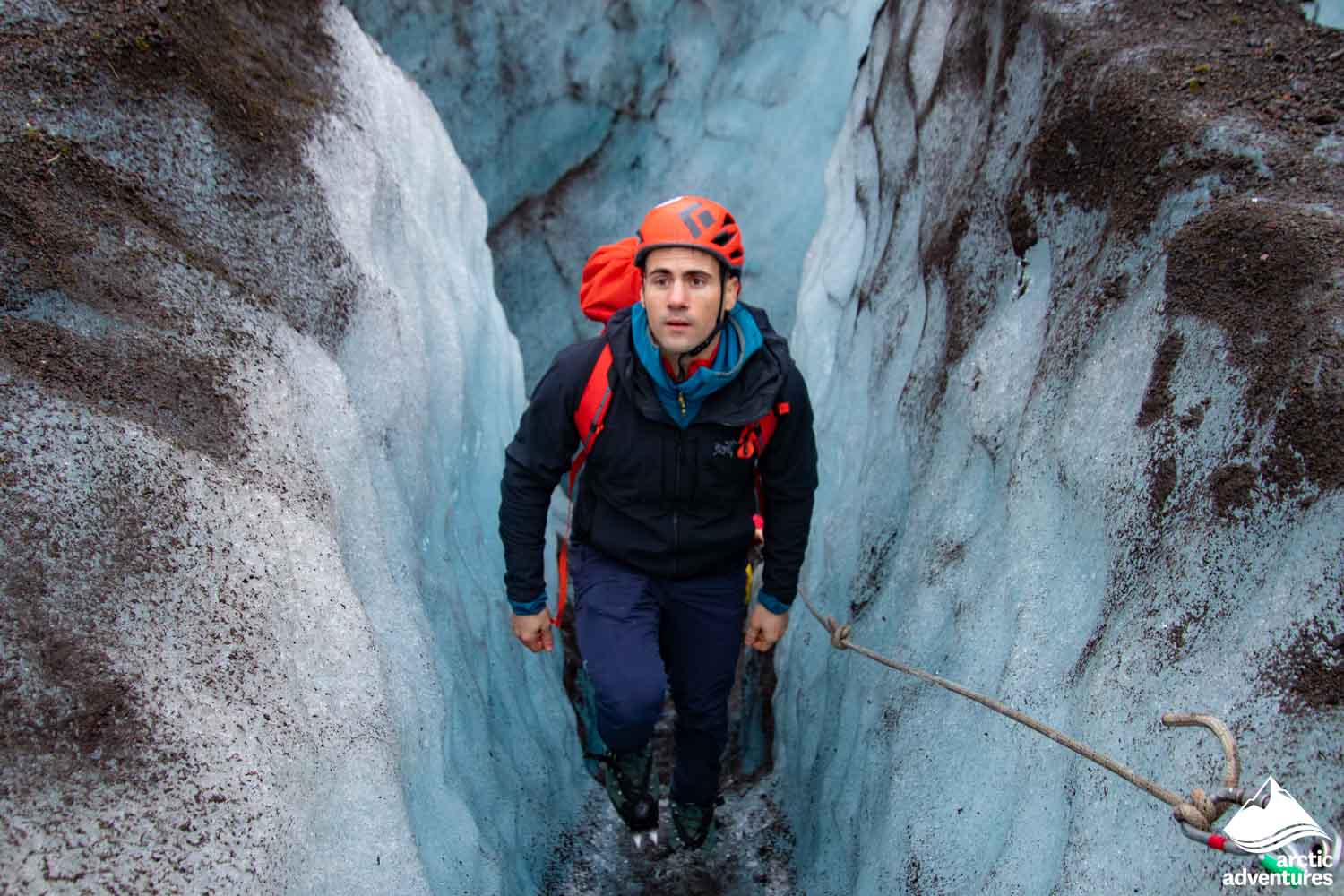 Glacier Guide Walking in Glacier Crevasse
