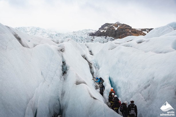 People Walking in Glacier Crevasses in Iceland