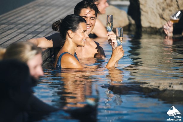 People Celebrating in Icelandic Hot Springs
