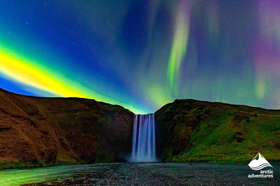 Northern Lights over Skogafoss Waterfall in Iceland