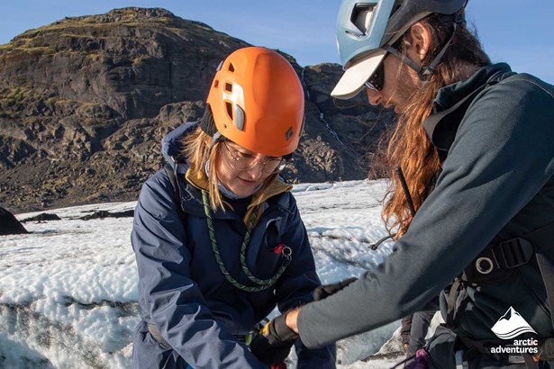 Glacier Guide Helps for Woman put Harnes