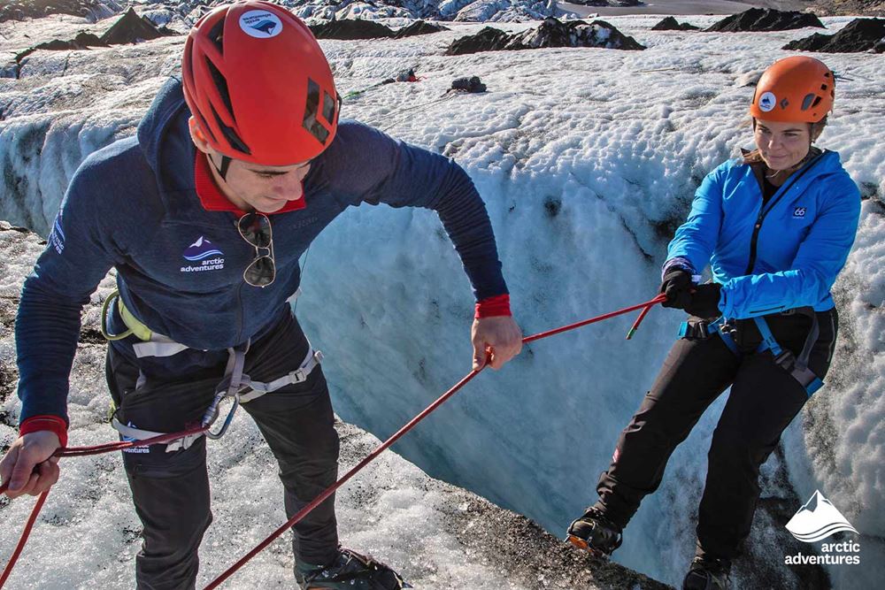 Guide Helping to Ice Climb