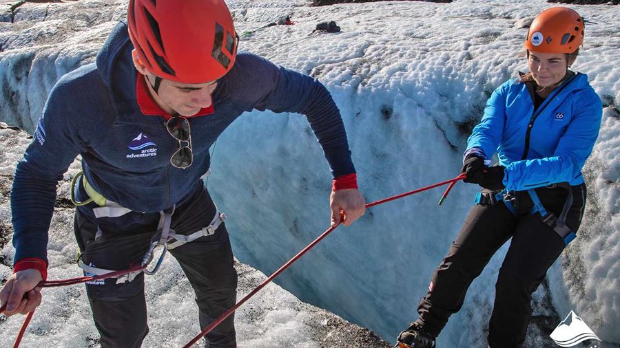 Guide Helping to Ice Climb