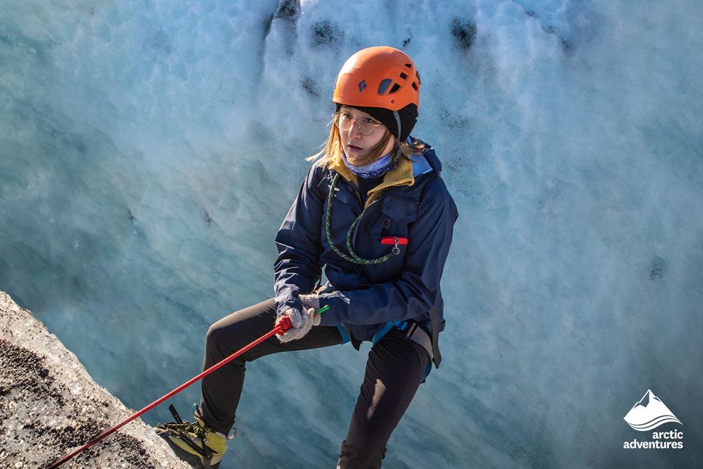 Woman Climbing on Glacier