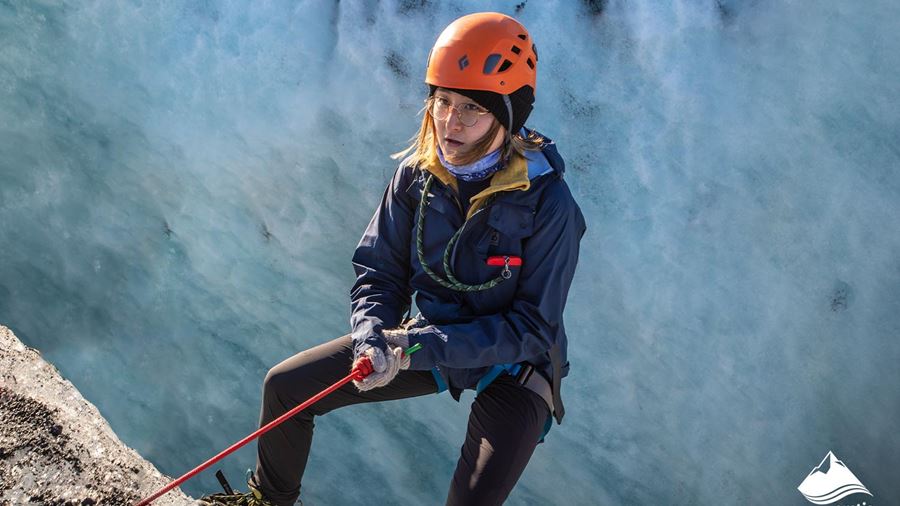 Woman Climbing on Glacier