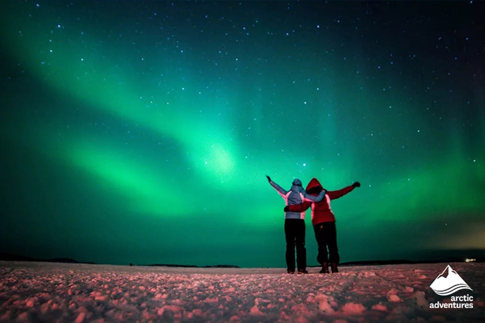 Friends Watching Northern Lights in Iceland