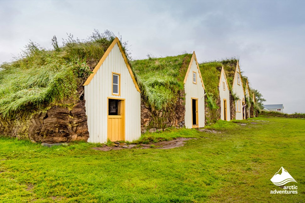 Traditional Icelandic houses with turfed roofs in a row.