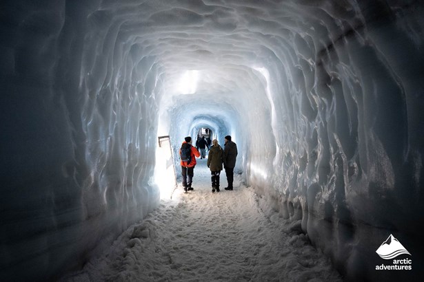 People in Ice Tunnel Inside of Glacier