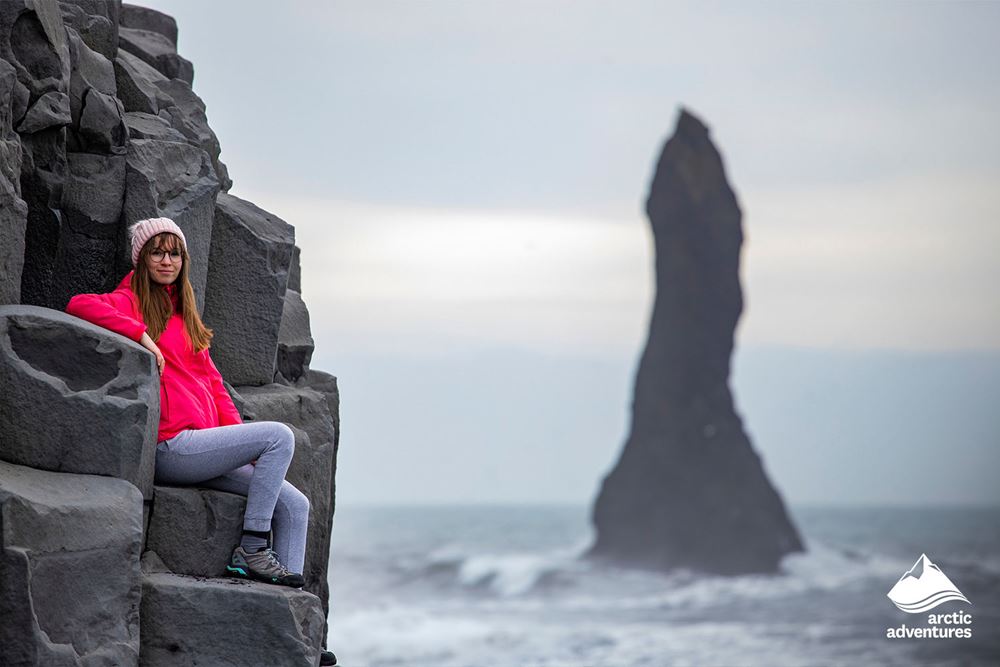 Girl Sitting on Basalt Columns