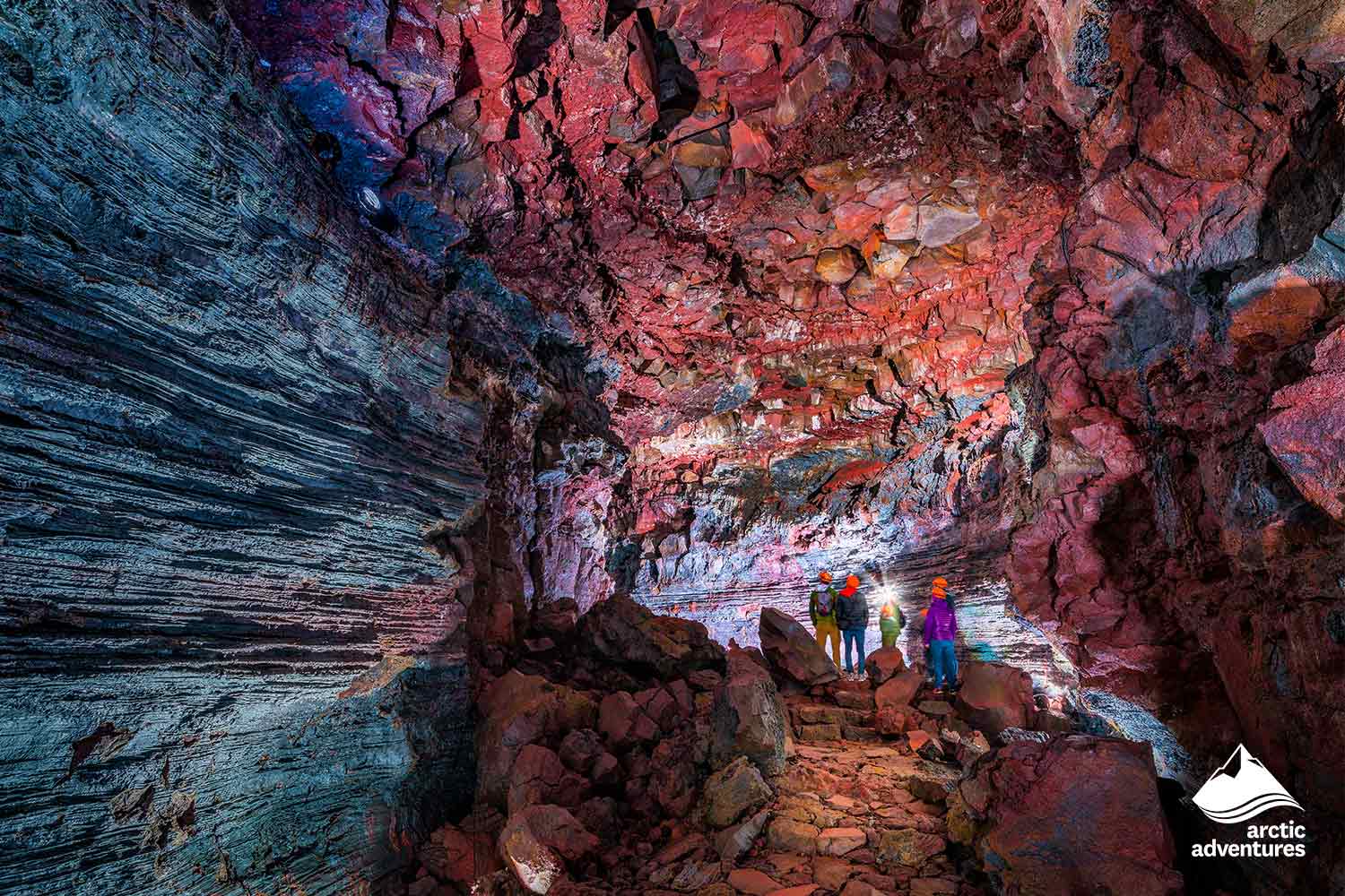 People Exploring Lava Tunnel