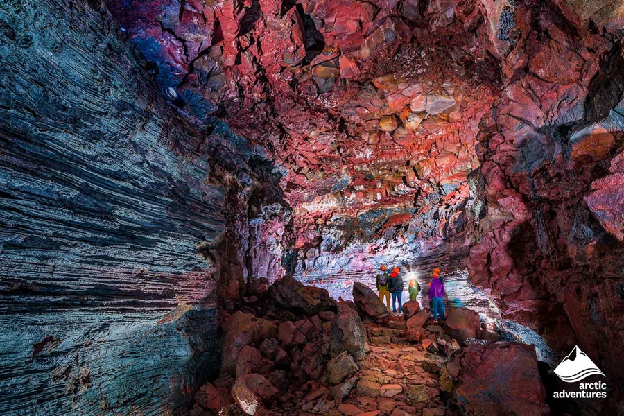 People Exploring Lava Tunnel