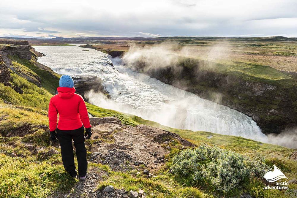 Woman Looking at Gullfoss Waterfall