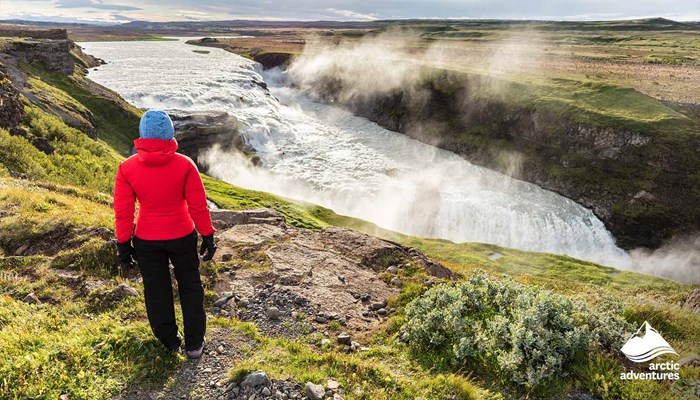 Woman Looking at Gullfoss Waterfall in Spring