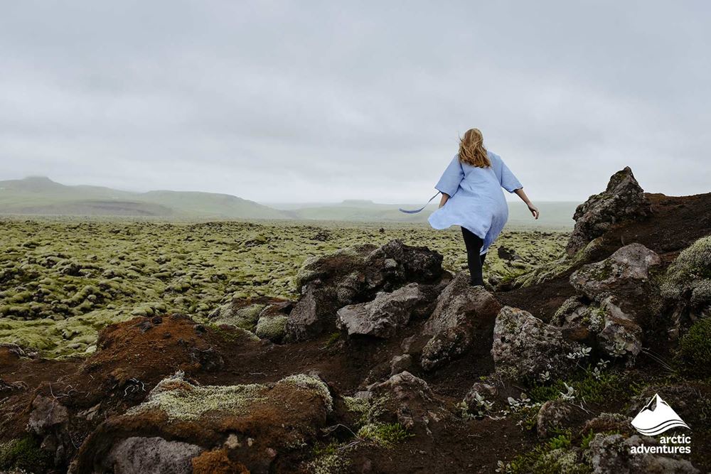 Woman Walking in Lava Field