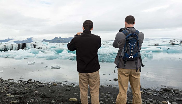 Two Men Photographing Glacier Lagoon in Iceland