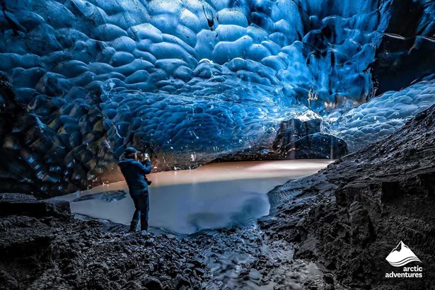 Woman in Blue Ice Cave in Iceland