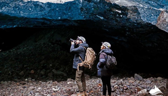 Couple Photographs Ice Cave in Iceland