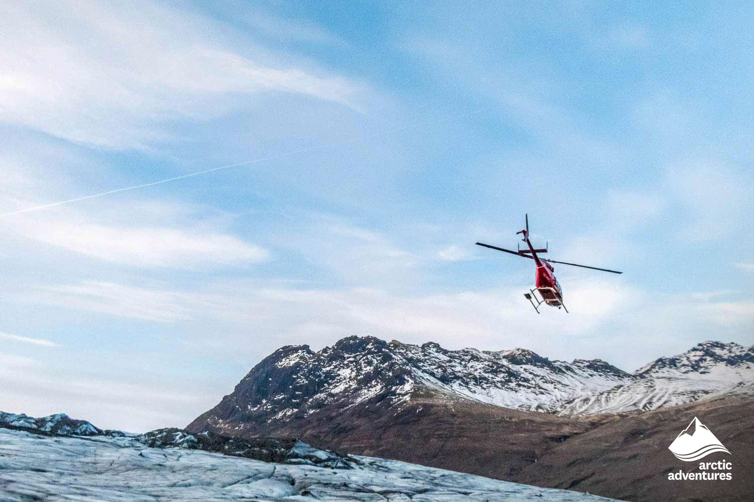 Helicopter Flying Over Glacier
