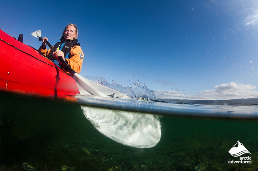 Woman Kayaking in Sea