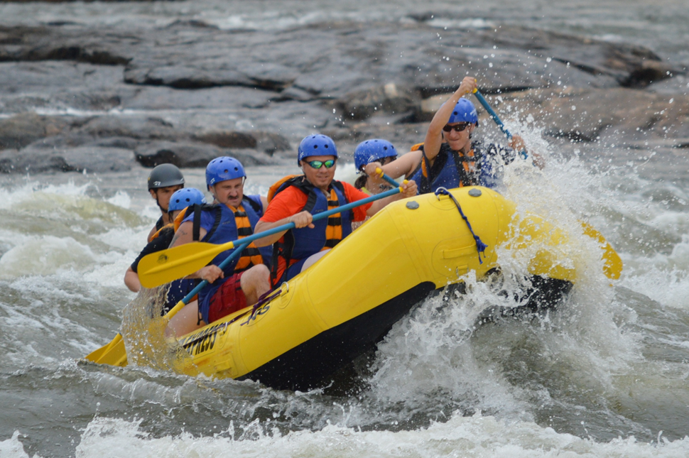 Rafters Paddling on River White Water Rafting