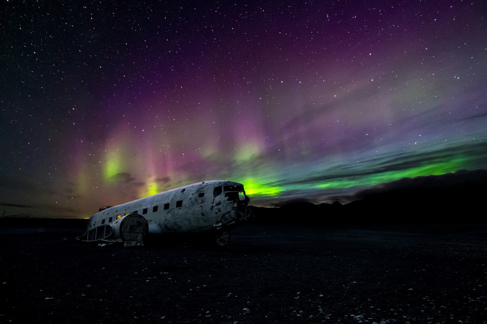 Aurora Borealis Over Plane Wreck Beach in South Iceland 