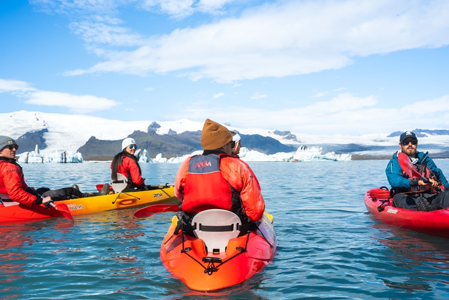 Group of People Kayaking in Iceland