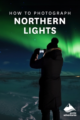 Woman Taking Photos of Northern Lights