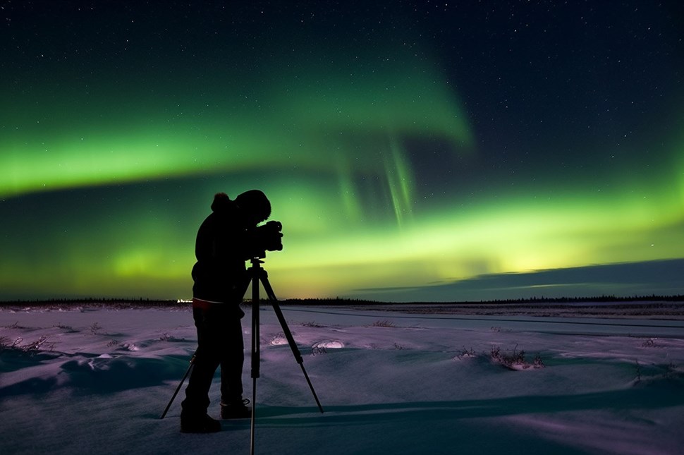 Man Photographs Aurora During Winter in Iceland