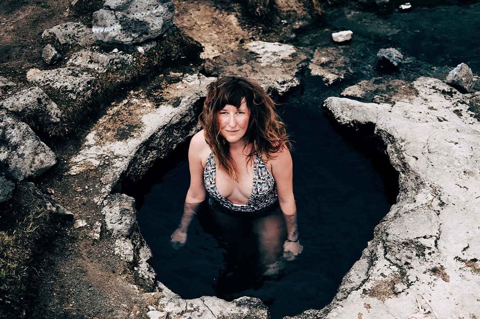Woman Standing In Landbrotalaug Hot Springs Iceland