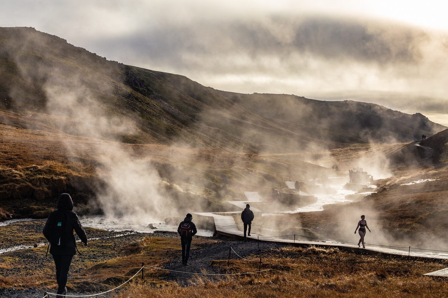 People Walking In Reykjadalur Hot Springs Iceland