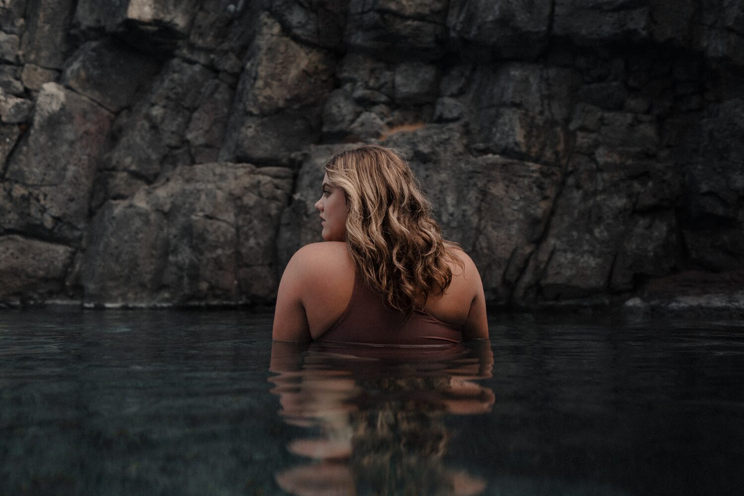 Woman In Water Of Sky Lagoon Iceland