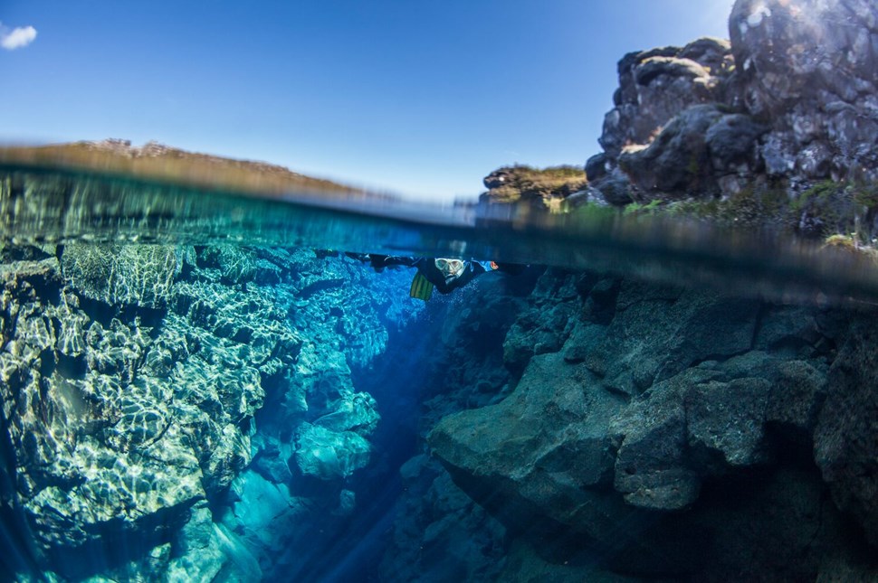 Person Snorkeling In Silfra Fissure Clear Waters