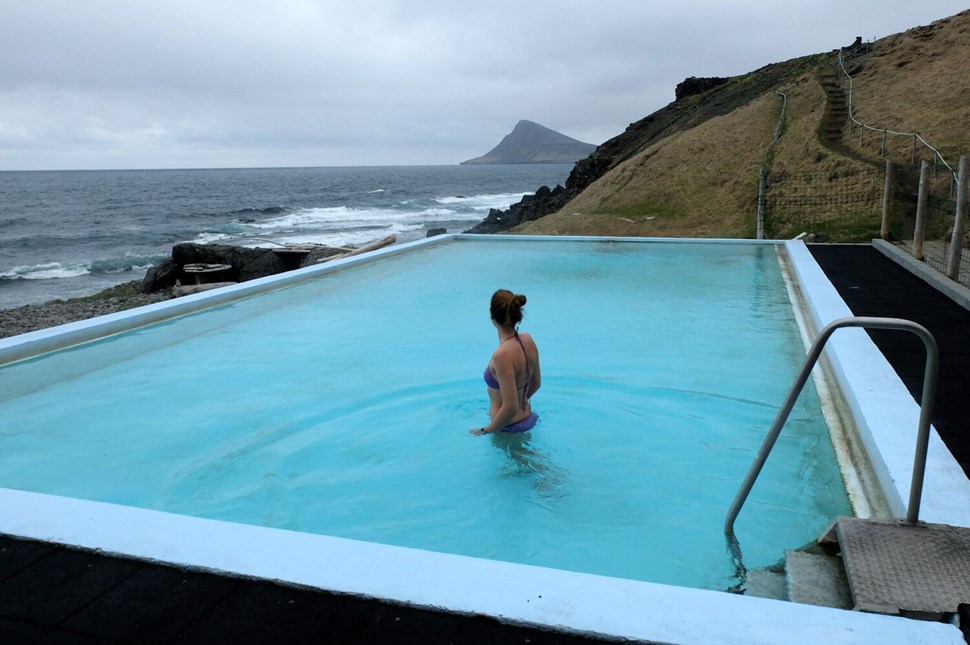 Tourist Standing In Krossneslaug Swimming Pool Iceland