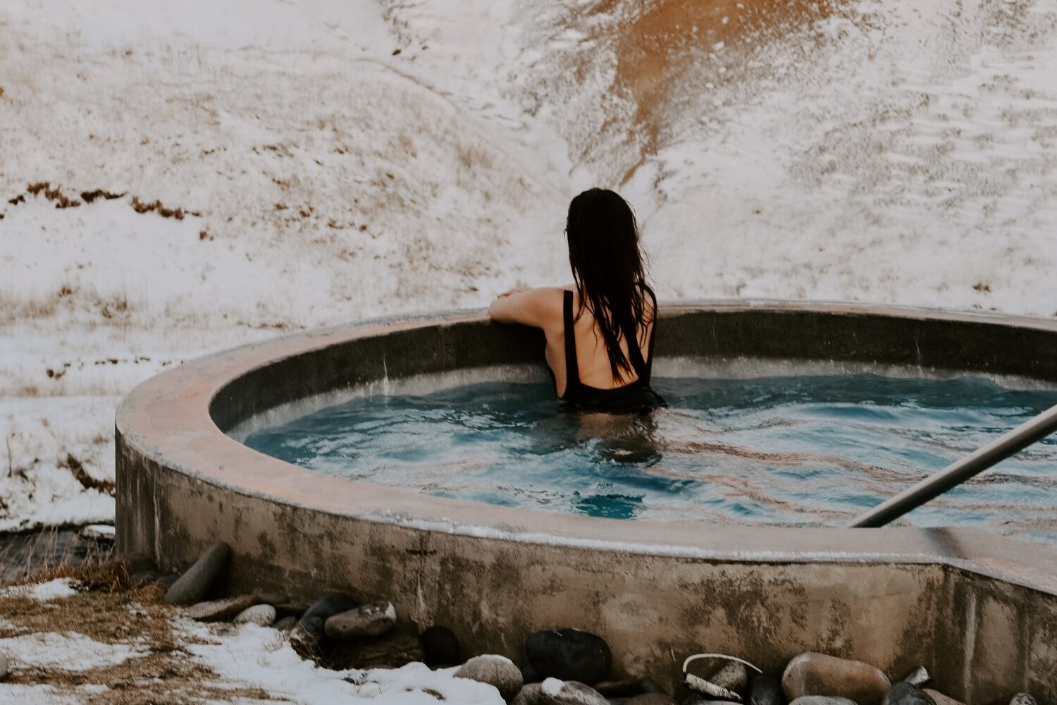 Woman Bathing In Geothermal Pool Iceland