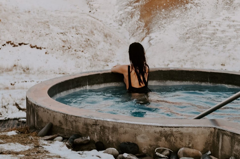 Woman Bathing In Geothermal Pool Iceland