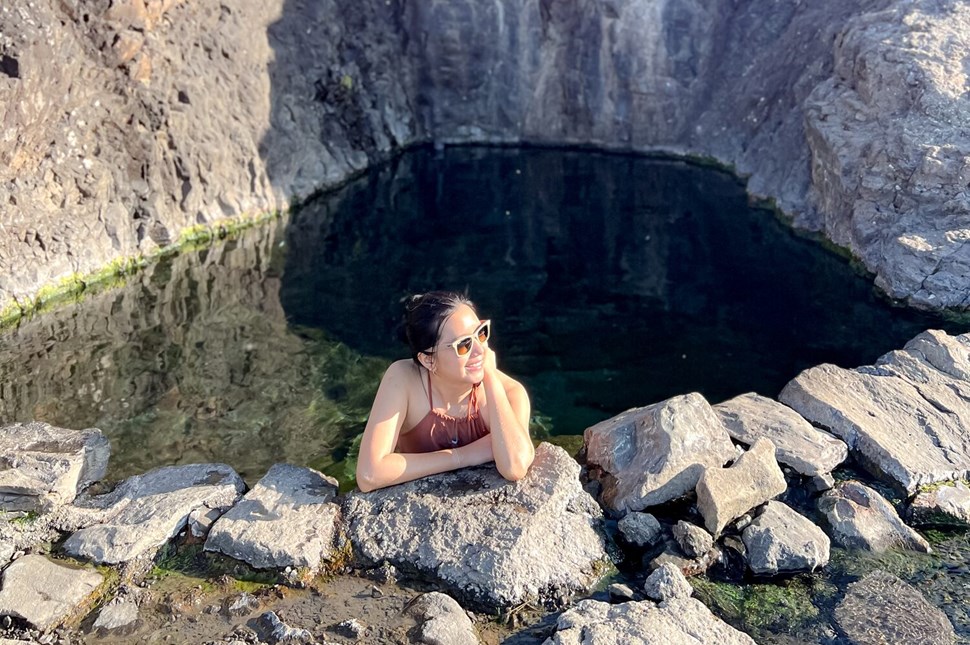 Woman Tourist Soaking In Hellulaug Hot Spring