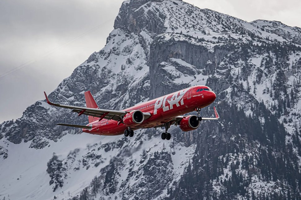 Red Play Aircraft Flying Over Mountains In Salzburg