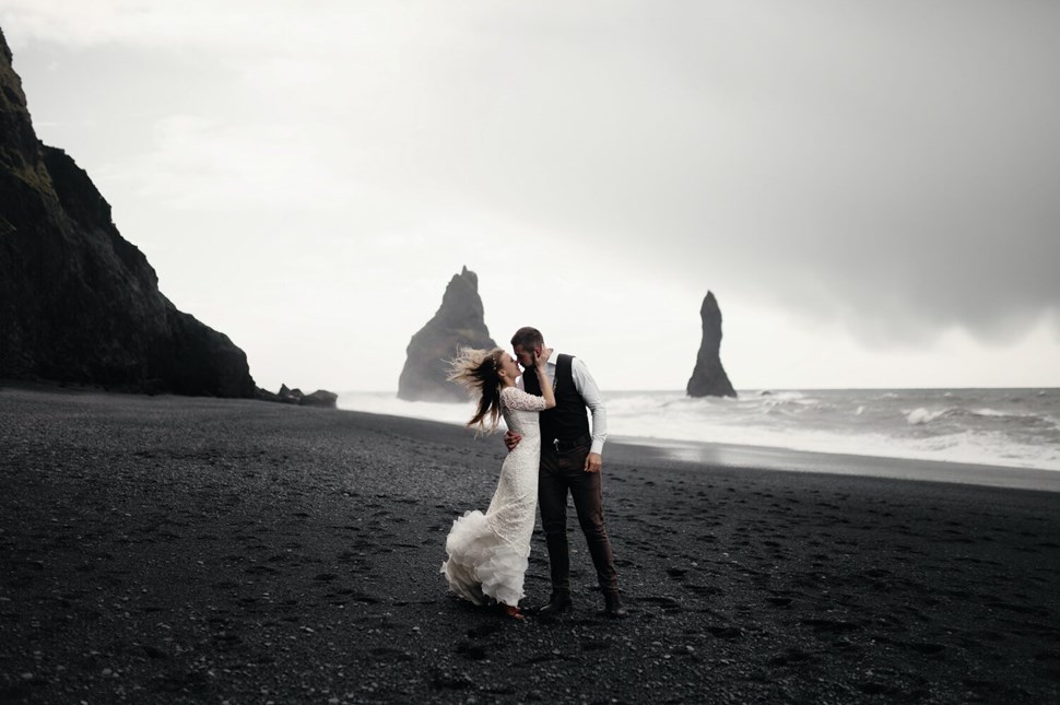Wedding couple on black sand beach in Iceland