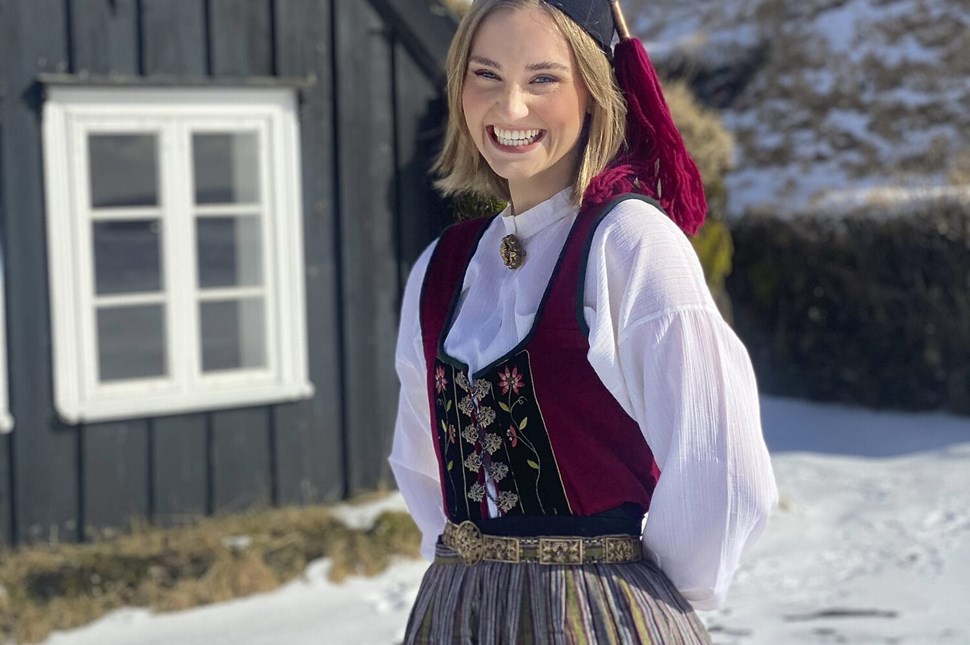 Icelandic woman wearing traditional costume smiling
