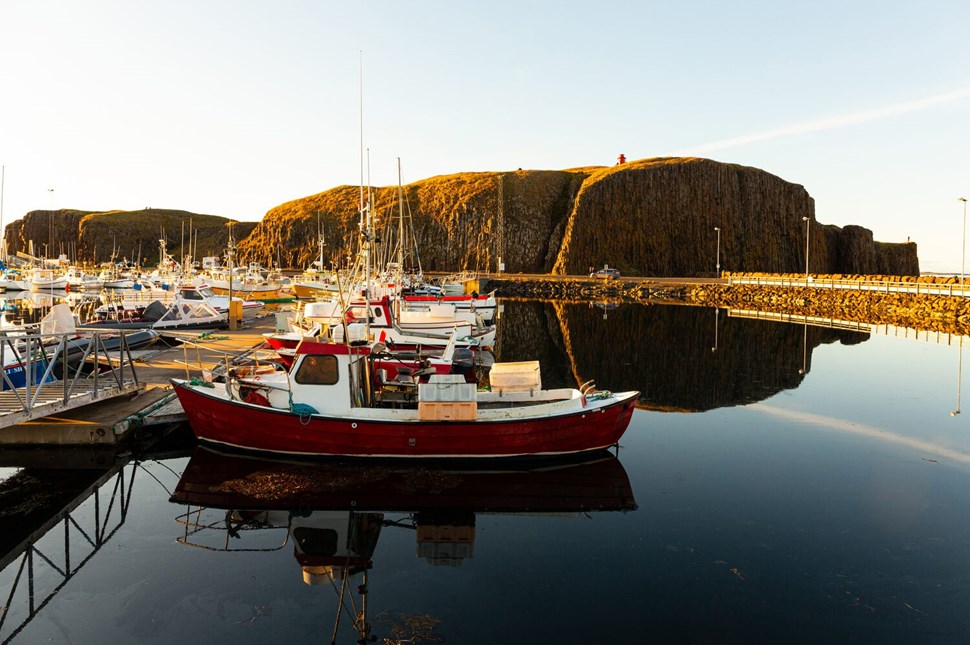 Boats during sunset in harbor of Stykkisholmur