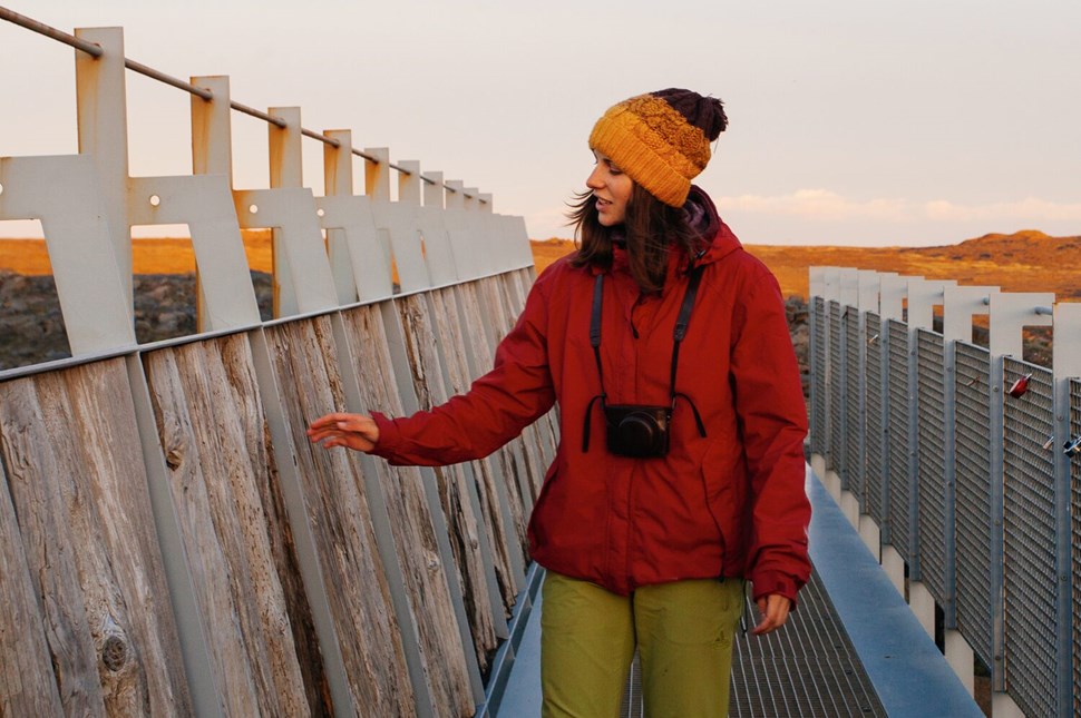 Woman standing on Famous Bridge Between Continents in Iceland