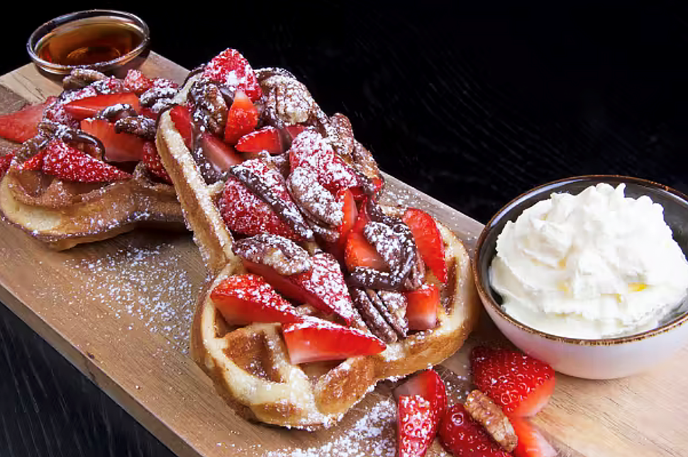 Phallus shaped waffle with chocolates and strawberries 