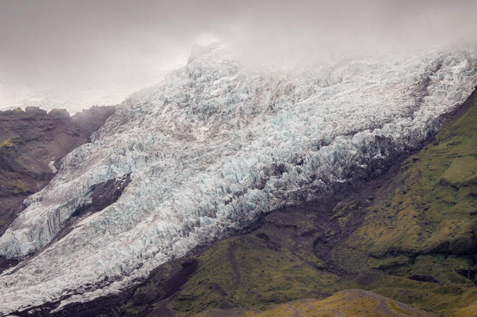 Jagged Icelandic glacier on a mountain on a cloudy day
