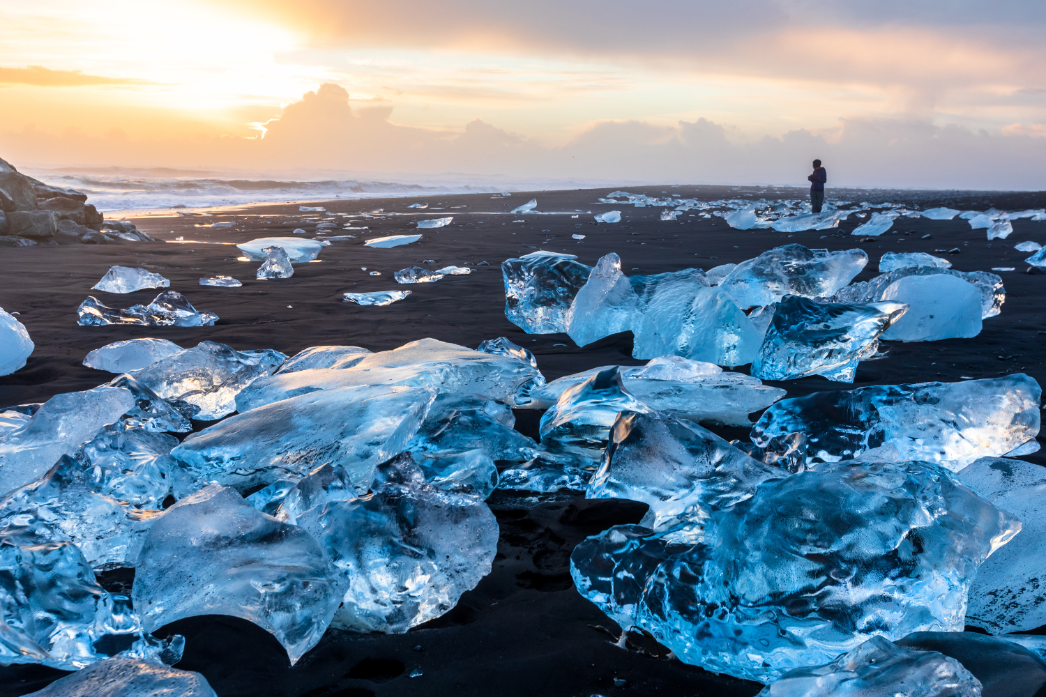 Diamond Beach scattered with ice melting on the contrasting black sand