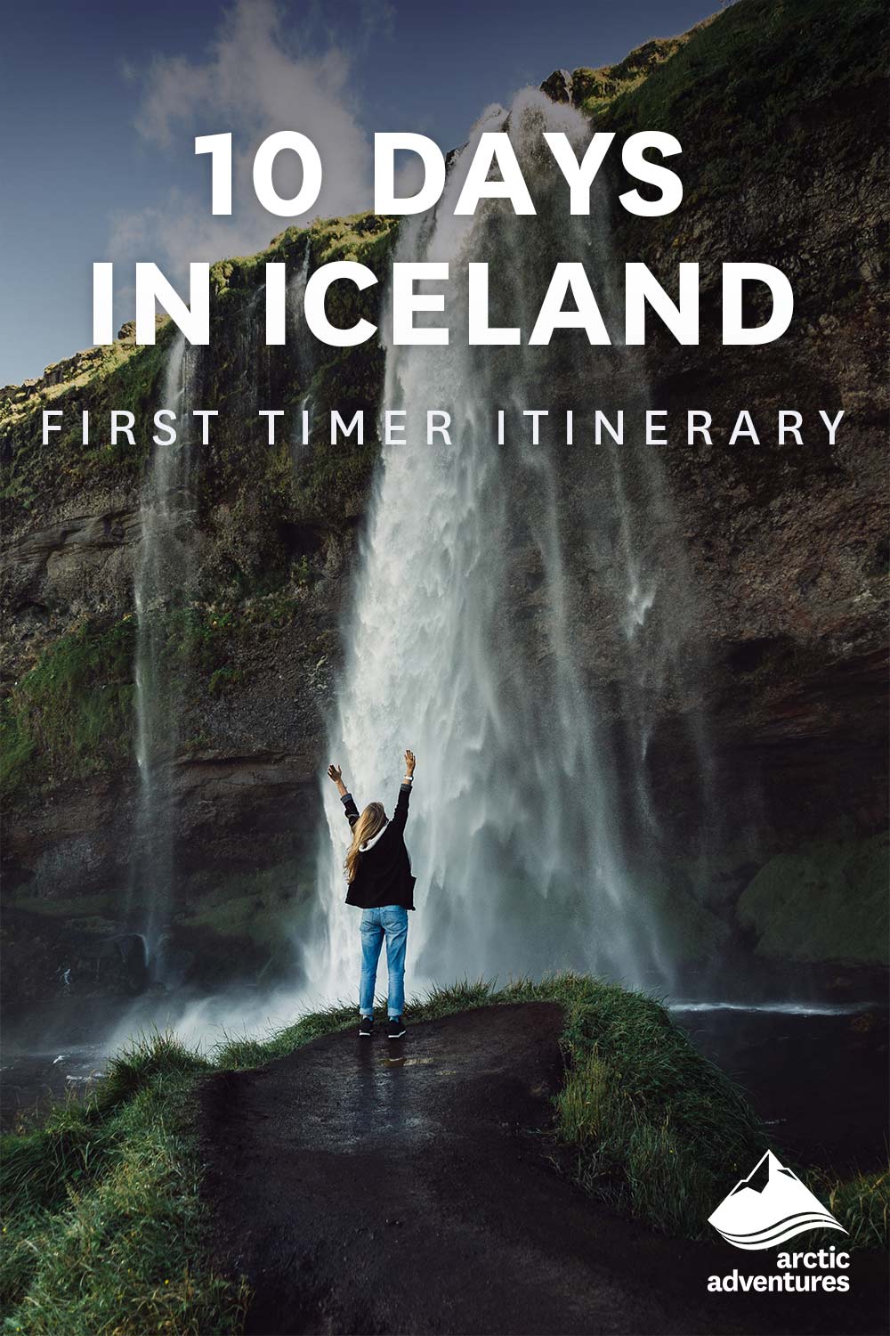 Person standing in front of a waterfall
