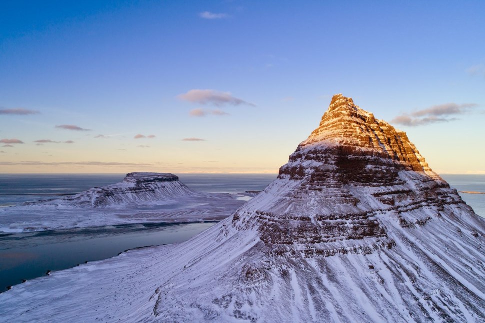 Aerial view of the snow-capped Kirkjufell mountain.