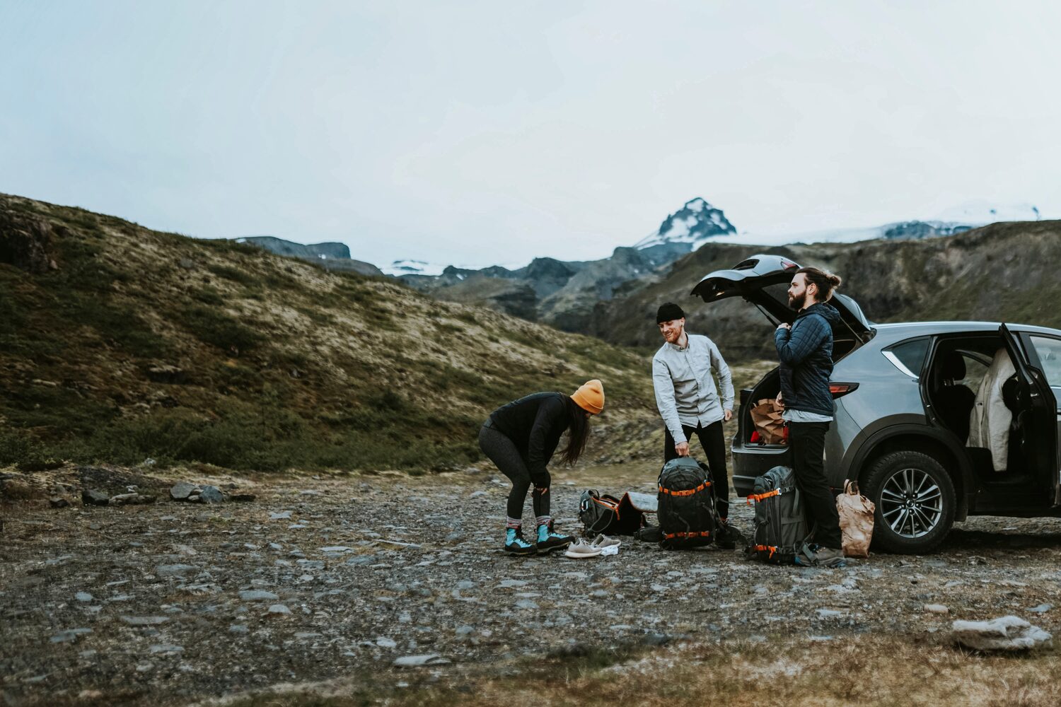People getting ready for a hike in the mountains
